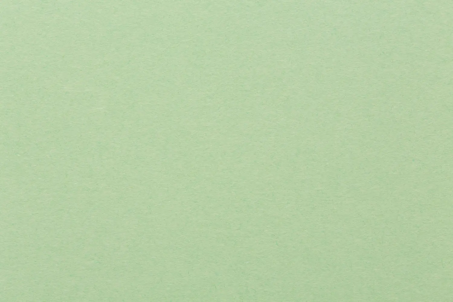 Hellgrüner Papierhintergrund, farbenfrohe Textur.